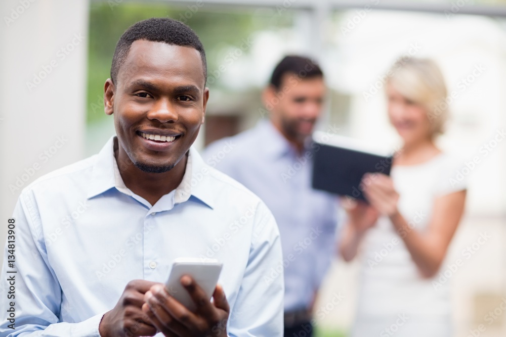 Fototapeta premium Portrait of a businessman using mobile phone
