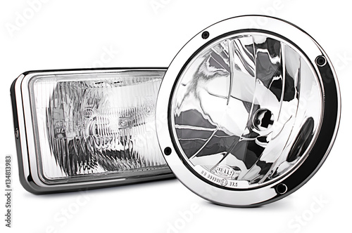 Closeup of car headlight isolated on white background,