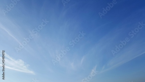 Clear blue sky with soft white cloud