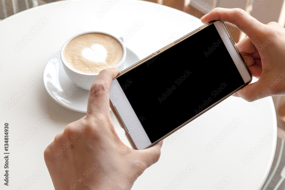 Taking photograph of coffee by smartphone