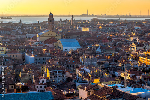 Aerial view of Venice  Italy  at sunset with rooftops of buildings and vintage colors in winter sunset.