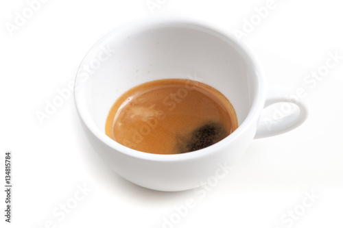 Espresso shot in the coffee cup on white background isolated wit