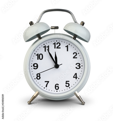 Alarm clock isolated on white, clipping path. Five minutes to tw