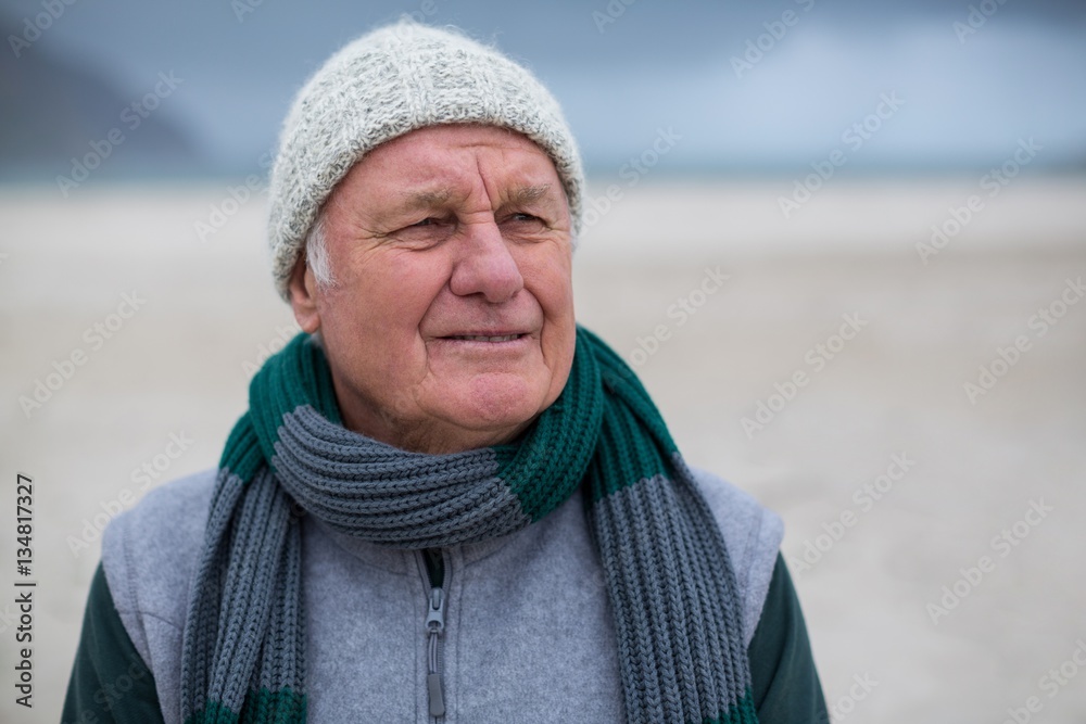 Senior man standing on the beach Senior man standing on the beach