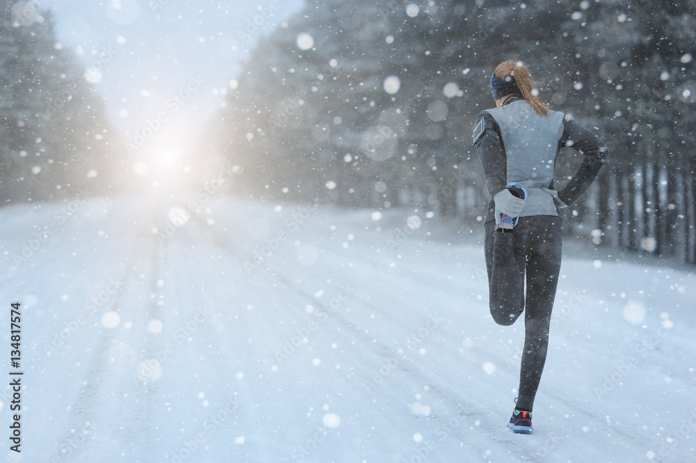 Stretching Running - woman runner doing exercises. Winter marath Stretching Running - woman runner doing exercises. Winter marath