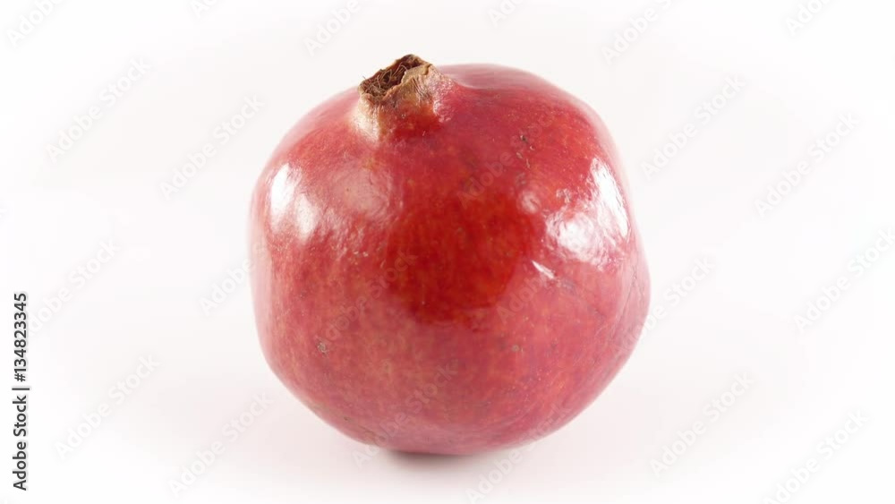 Whole Tropical Pomegranate Fruit Rotating Isolated by White Background Whole Tropical Pomegranate Fruit Rotating Isolated by White Background