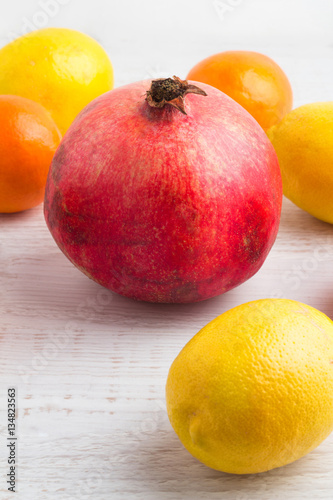 pomegranate and citrus on a white background