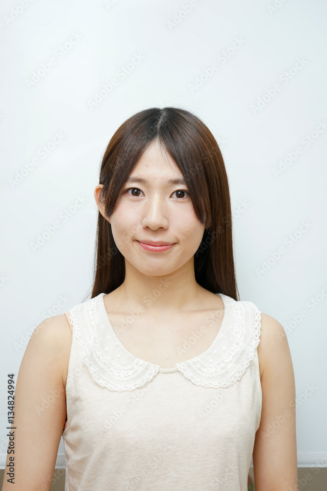 Young woman on the white background