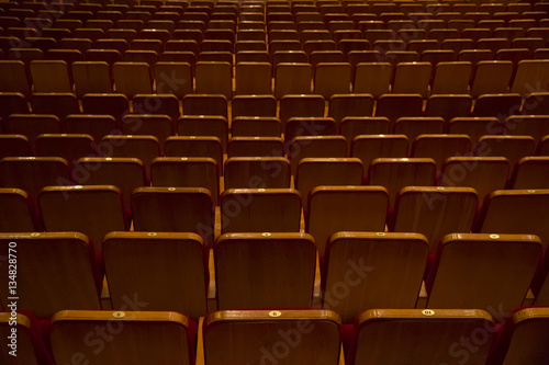Empty theater seats behind