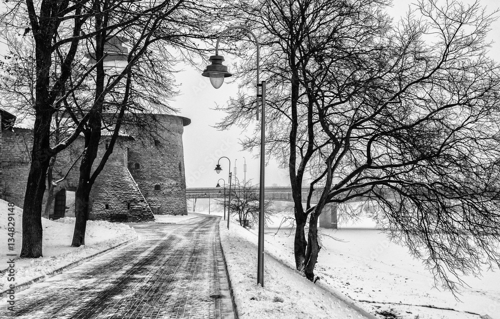 Winter landscape with Pskov intercession tower in the background the snow-covered embankment Winter landscape with Pskov intercession tower in the background the snow-covered embankment