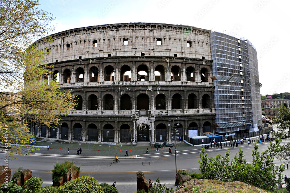 ROME, ITALY - APRIL 3, 2014: The Colosseum - a monument of architecture of ancient Rome in the spring sunny day