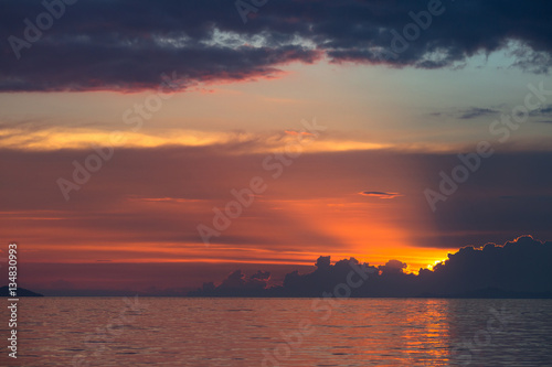 sun rays with storm clouds on the sea.Sunset in Thailand