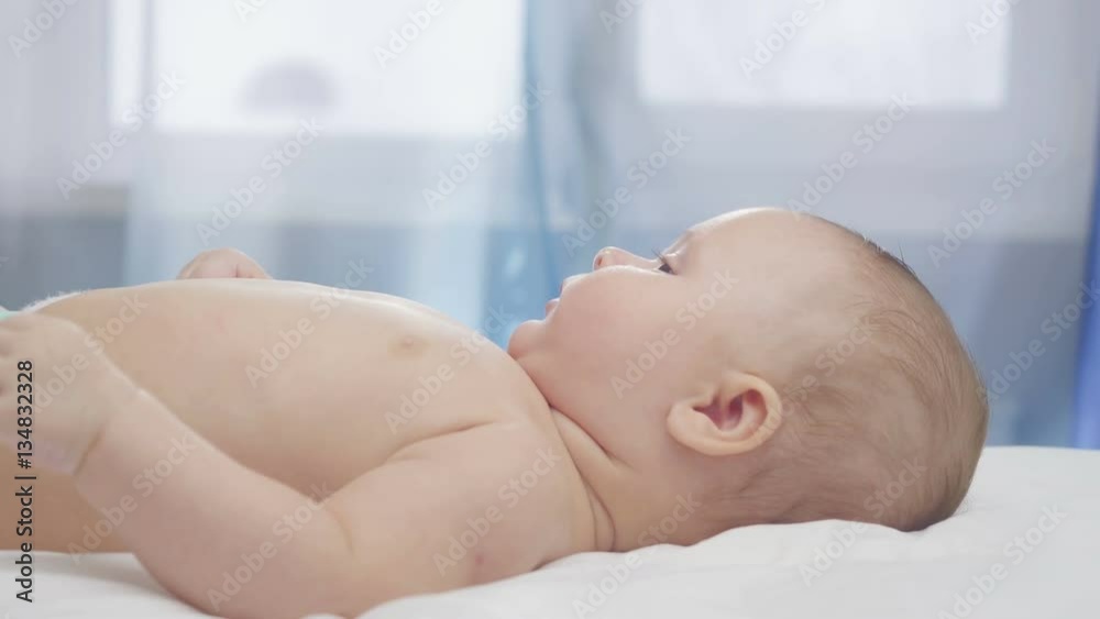 Mother kissing сute 4-month-old baby.
Mother kissing сute 4-month-old baby.