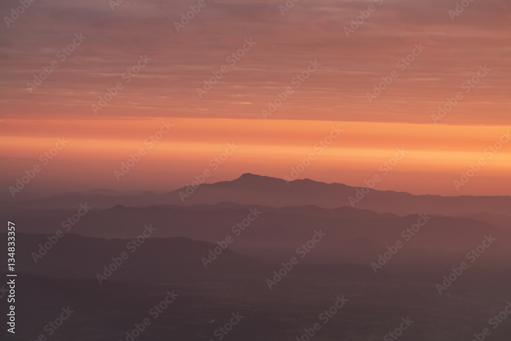 layer of mountains with misty in morning