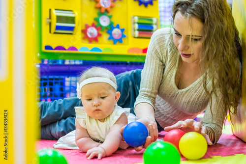 mother and child play in the children's room