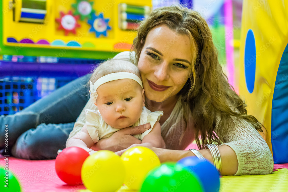 mother and child play in the children's room mother and child play in the children's room