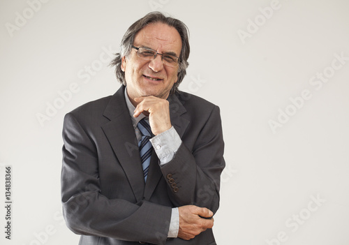 Portrait of businessman on gray background