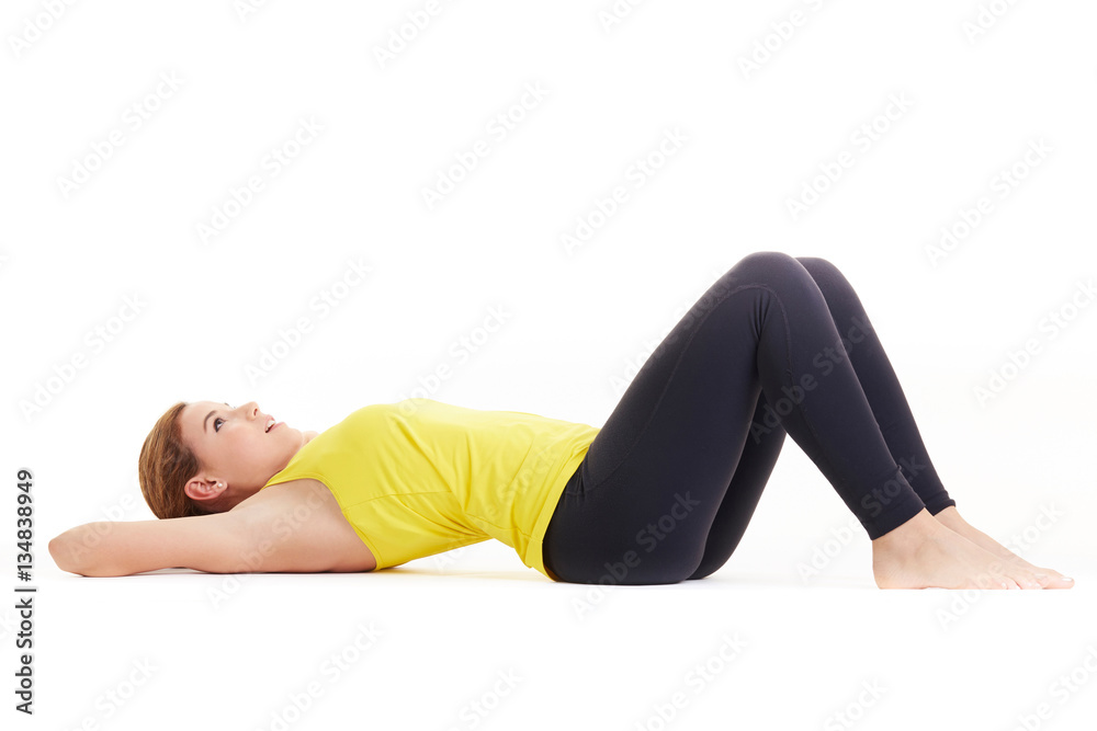 Fit woman stretching her leg to warm up Fit woman stretching her leg to warm up