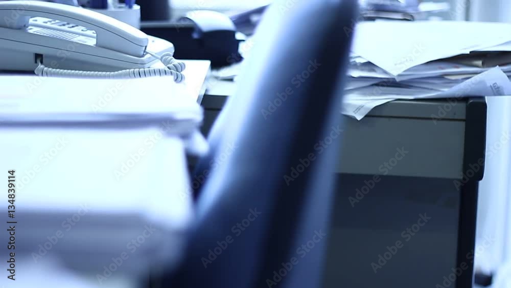 Papers and documents on a desk in the office Papers and documents on a desk in the office