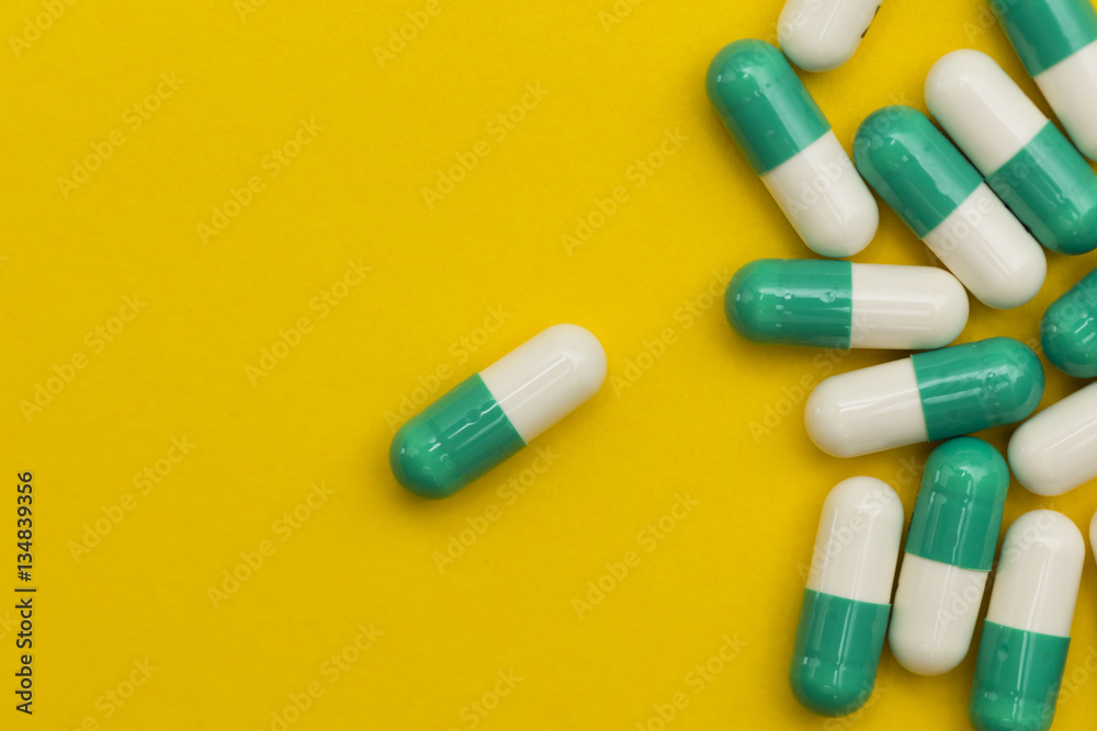 Medication pills on a bright background