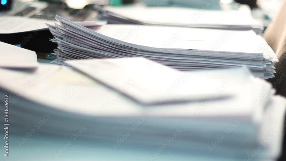 Close up of paper stacks, unsolved paper documents in the office. Shallow DOF. Suitable for backgrounds. Close up of paper stacks, unsolved paper documents in the office. Shallow DOF. Suitable for backgrounds.