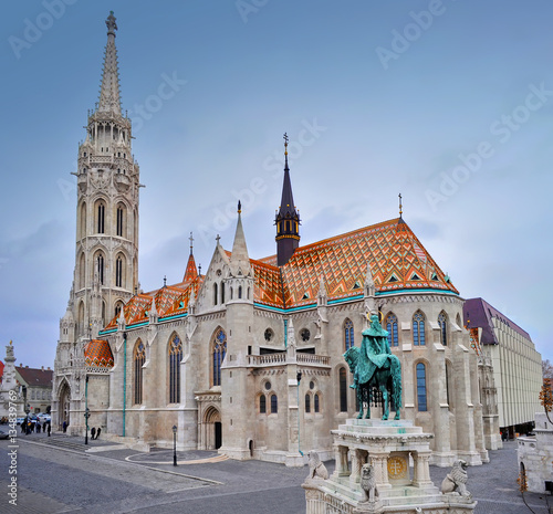 View on the Matthias Church and a sculpture of a man on a horse on a winter day. Shot from above. Budapest.