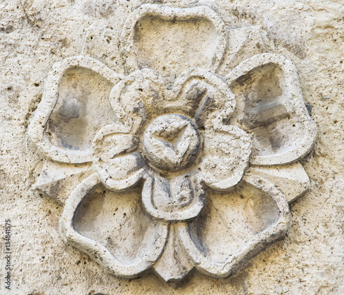 Pattern of flower carved on stone.