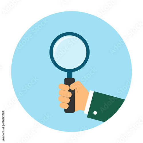 Holding magnifying glass