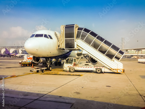 Airplane on the runway that prepare to taking off at Suvarnabhumi airport, Thailand, One of the most busiest airport in Asia.