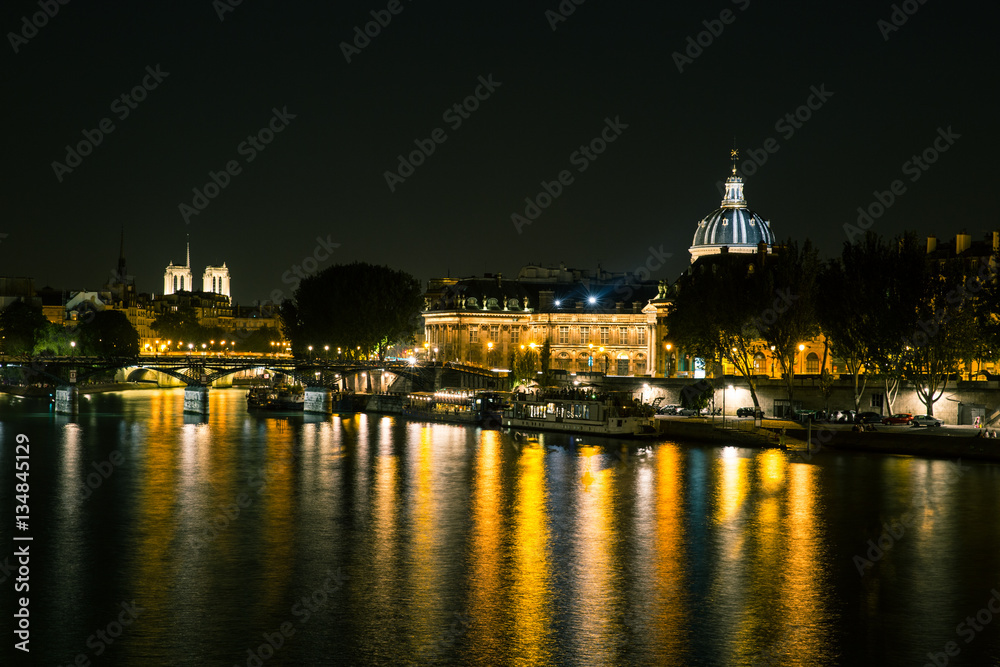 Reflections on the River Seine in Paris at night