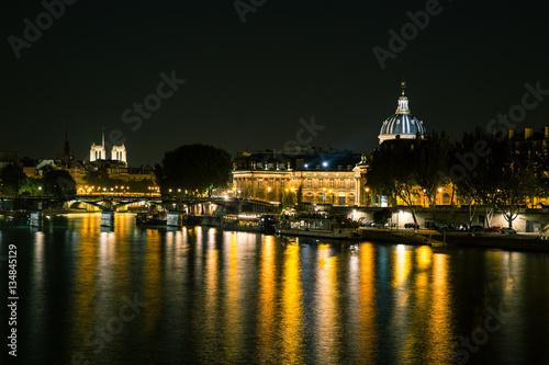 Reflections on the River Seine in Paris at night