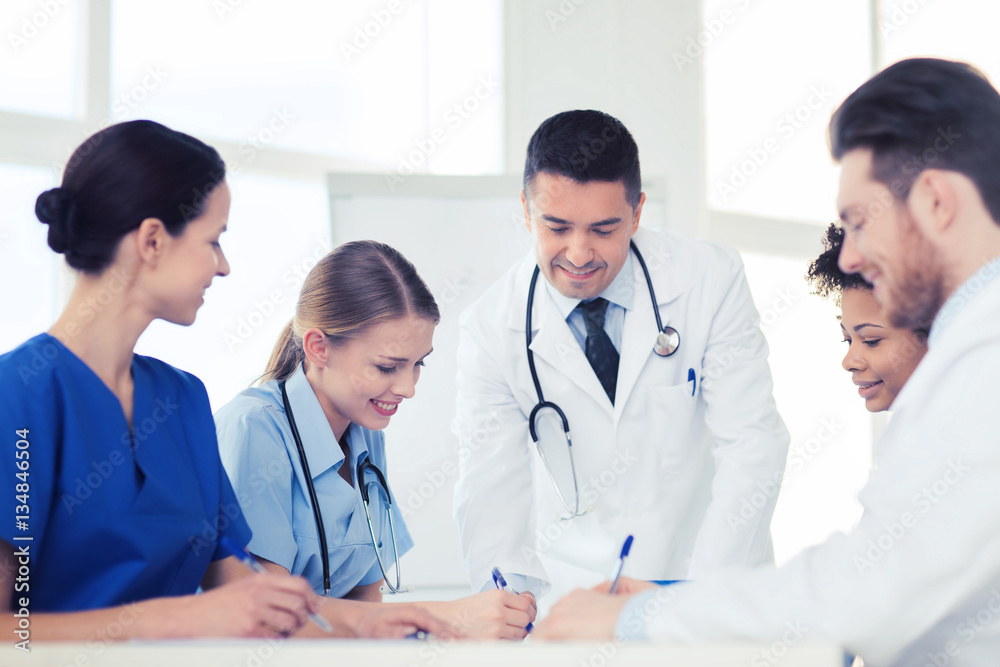 group of happy doctors meeting at hospital office group of happy doctors meeting at hospital office
