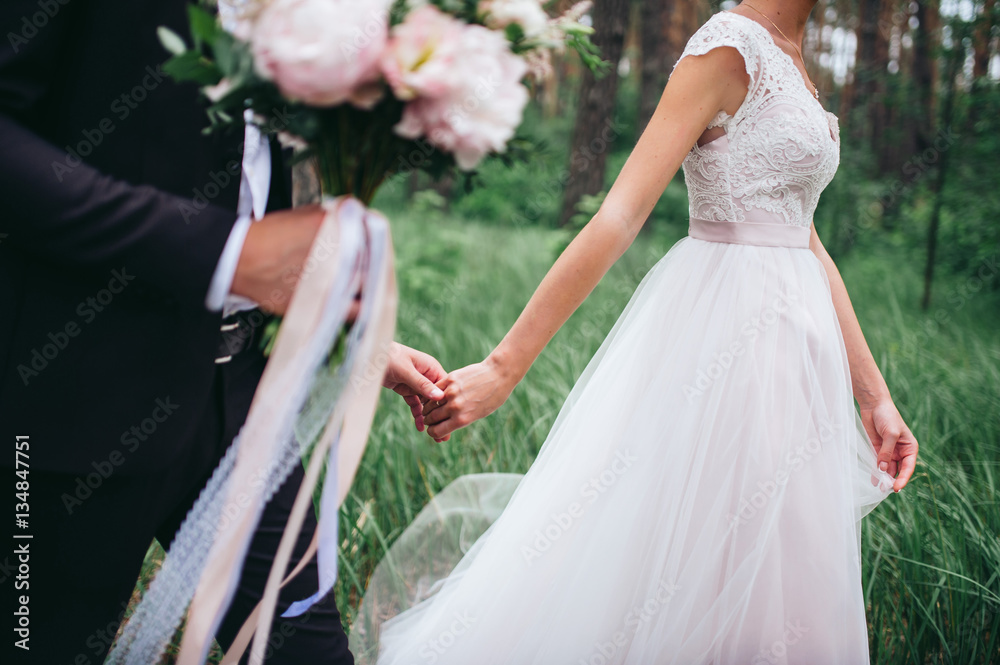 Bride and groom walking together Bride and groom walking together