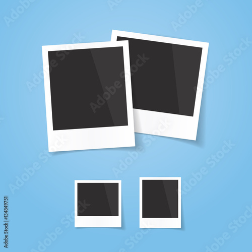 Realistic looking polaroid photo frames, isolated on blue background, vector illustration. Easy to use for your design with transparent shadows.
