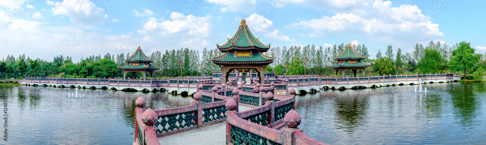 Ancient Siam (Ancient City, Muang Boran) park, view Sala of Ramayana on water at the bright blue Ancient Siam (Ancient City, Muang Boran) park, view Sala of Ramayana on water at the bright blue