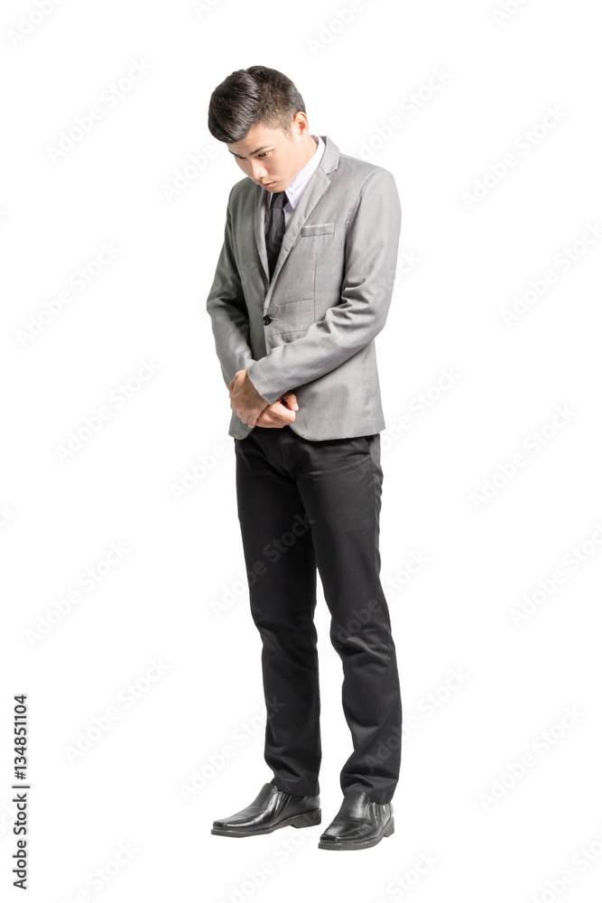 Portrait of a regret young business man. Isolated full body on w Portrait of a regret young business man. Isolated full body on w