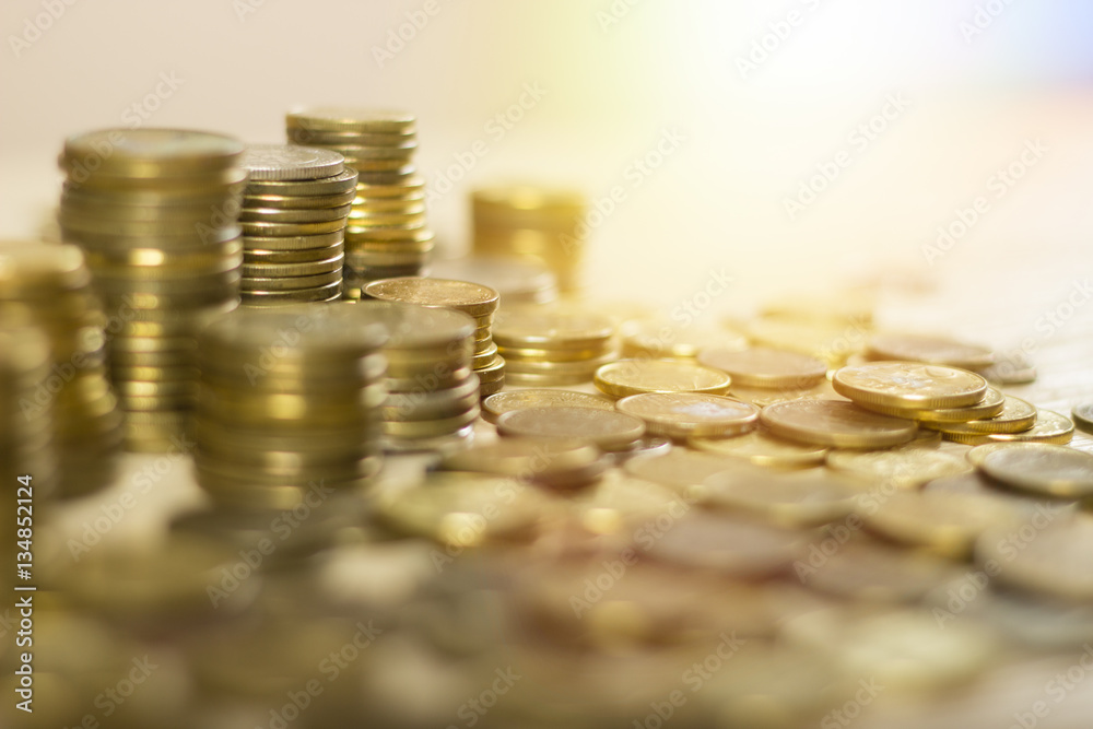 Close up of some gold coins. At the jewelers. Pawn shop. Money on the table. Lensflare in the