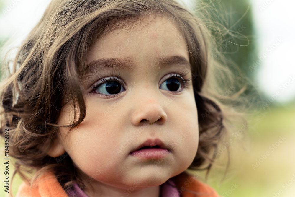 Portrait of a girl 2-3 years. Face close-up.
Portrait of a girl 2-3 years. Face close-up.