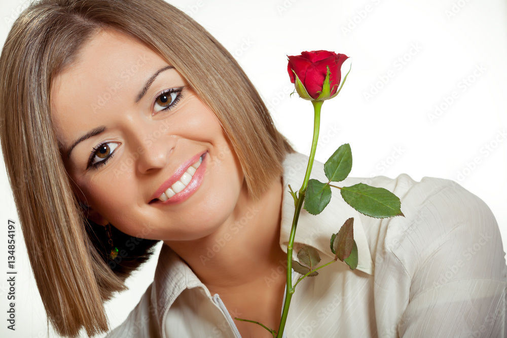 Close-up portrait of young beautiful woman with red rose Close-up portrait of young beautiful woman with red rose