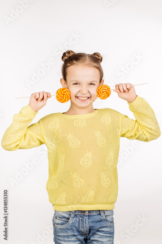 little girl with lollipops