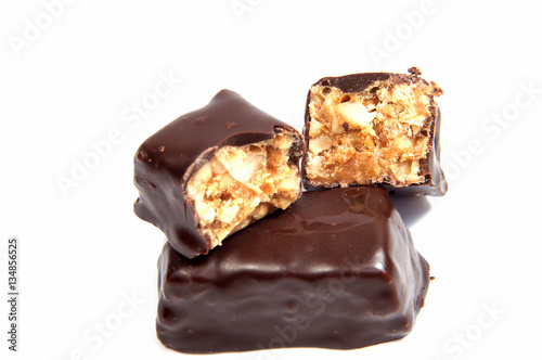 Chocolate candy with nuts isolated on white background.