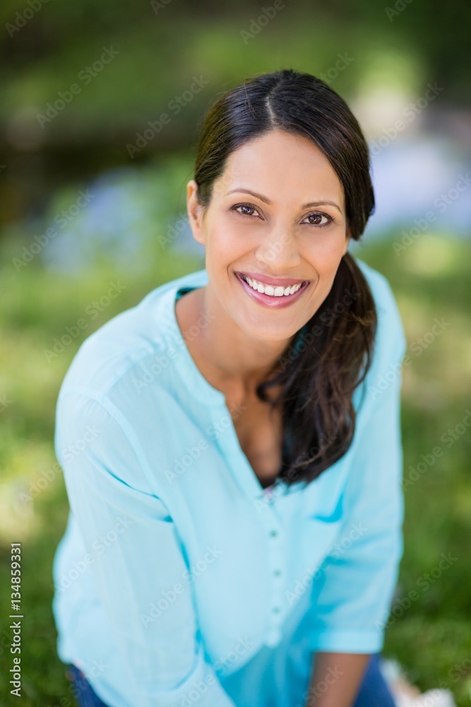 Portrait of woman smiling in park Portrait of woman smiling in park
