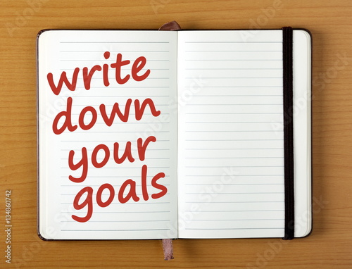 Canvas Print The words Write Down Your Goals in red text on a notebook page as a reminder and