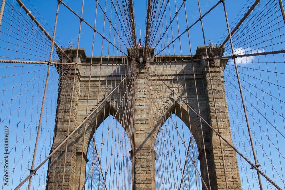 Fototapeta premium Symmetry of Brooklyn bridge and cable with blue sky, New York