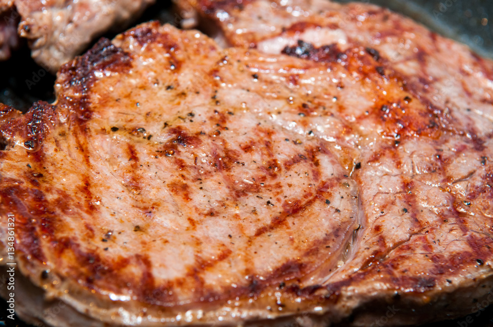 Steak dinner cooking on the grill Steak dinner cooking on the grill