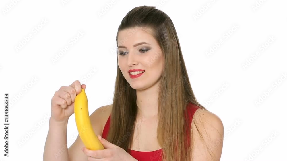 beautiful girl eats banana on white background beautiful girl eats banana on white background