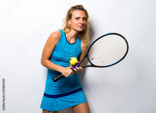 Blonde woman playing tennis © luismolinero