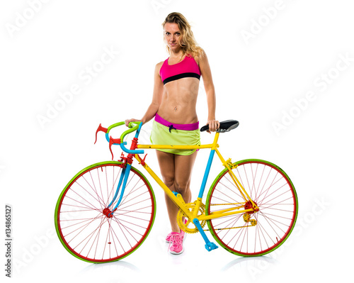 Beautiful blonde woman with colorful bike