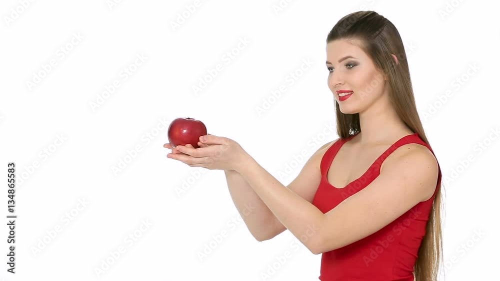 woman holding red Apple and smiling on white background woman holding red Apple and smiling on white background