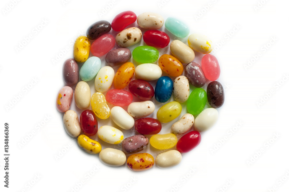 Brightly colored candy beans. Colourful jelly bean background. Jelly beans isolated on white background. Brightly colored candy beans. Colourful jelly bean background. Jelly beans isolated on white background.